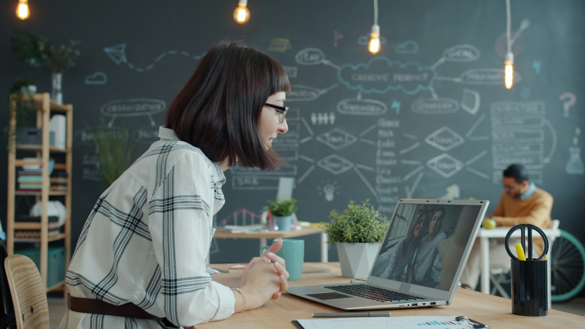Professional woman connecting with attendees in a live webinar